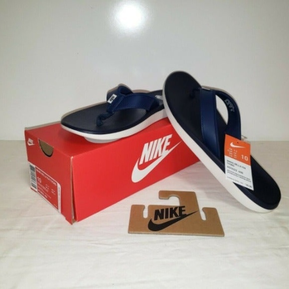 navy blue nike flip flops